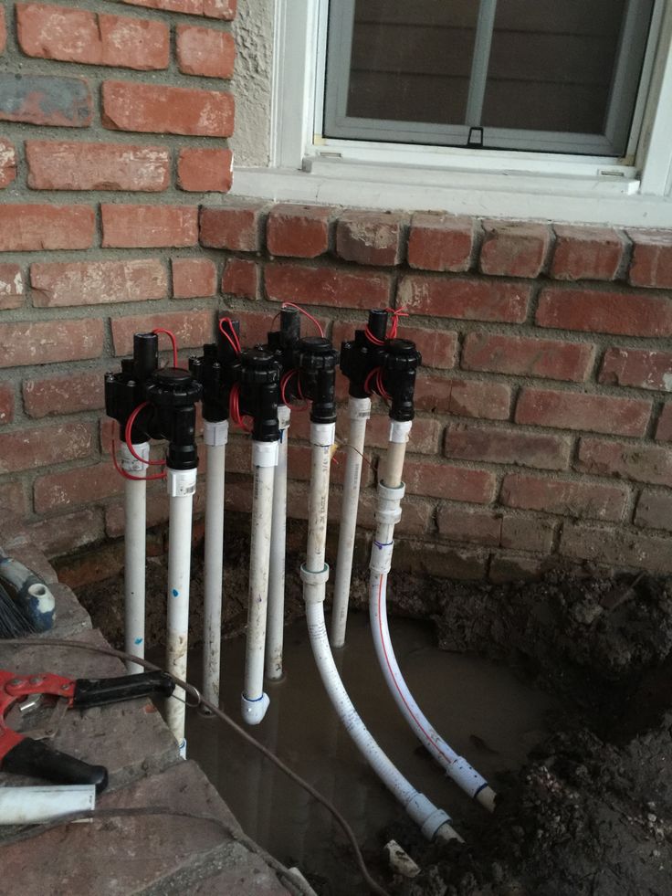 Engineers inspecting fire protection conduits and piping